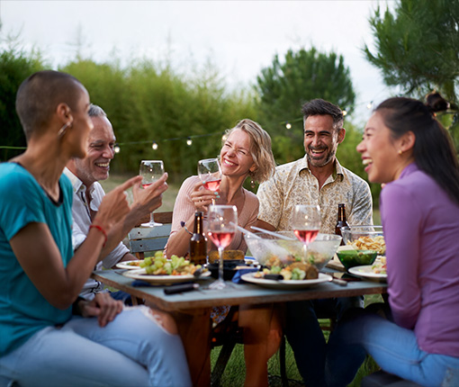 friends having dinner together outdoors